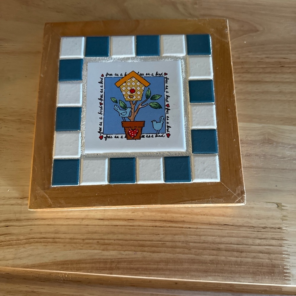 Decorative Tile with Birdhouse Design